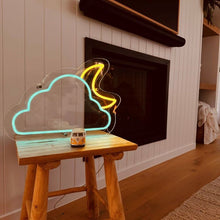 Load image into Gallery viewer, neon-sign-light-blue-cloud-yellow-moon-standing-on-a-table-infront-of-a-fireplace-and-vj-wall
