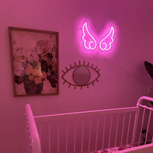 Load image into Gallery viewer, Pink-angel-wing-shape-neon-artwork-on-a-nursery-wall-above-a-cot-in-a-glowing-neon-pink-room
